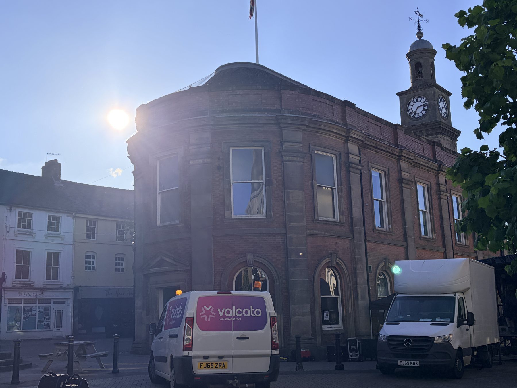 Valcato van outside a historic town hall at sunrise during a festival build