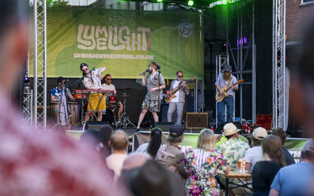 A band plays the Lymelight Festival main stage to a town-centre crowd