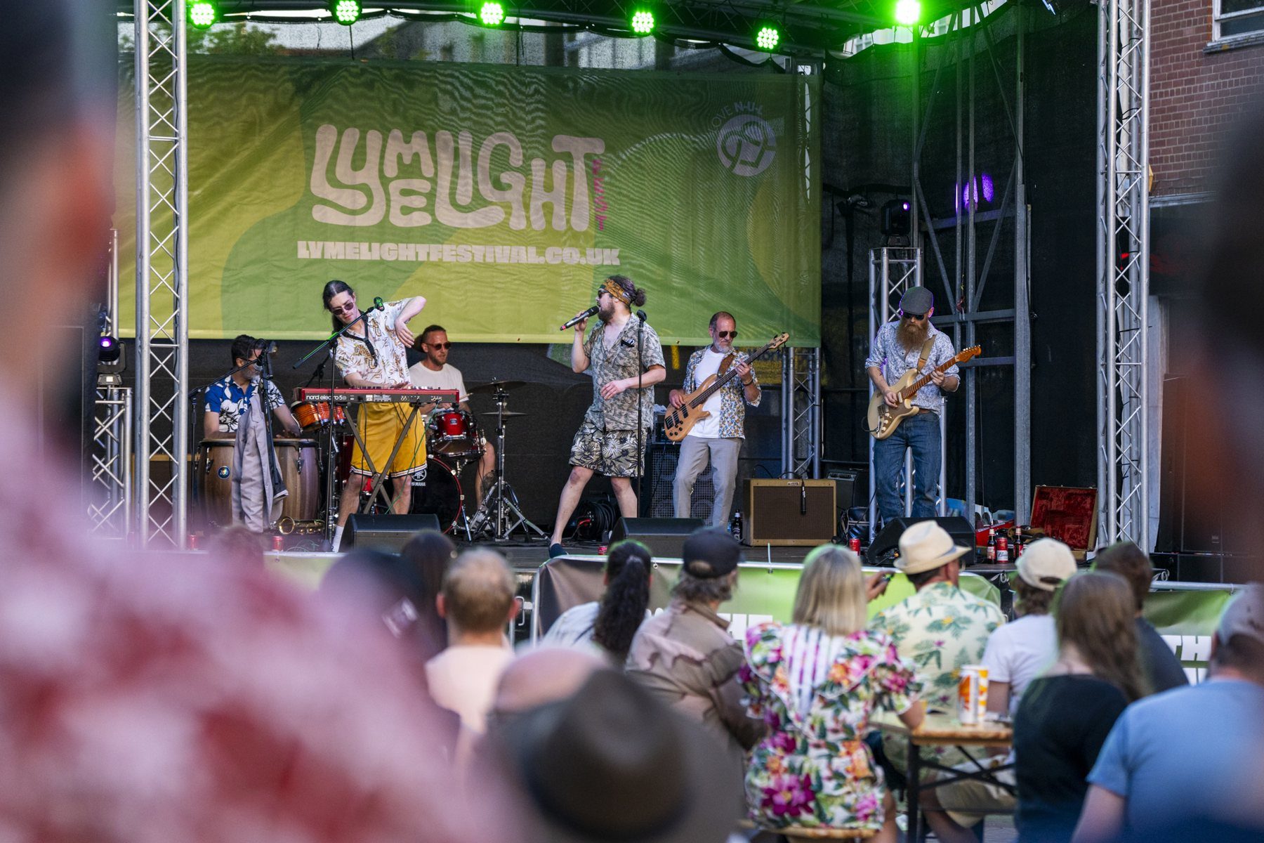 A band plays the Lymelight Festival main stage to a town-centre crowd